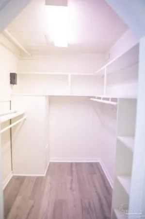 a view of an empty walk in closet