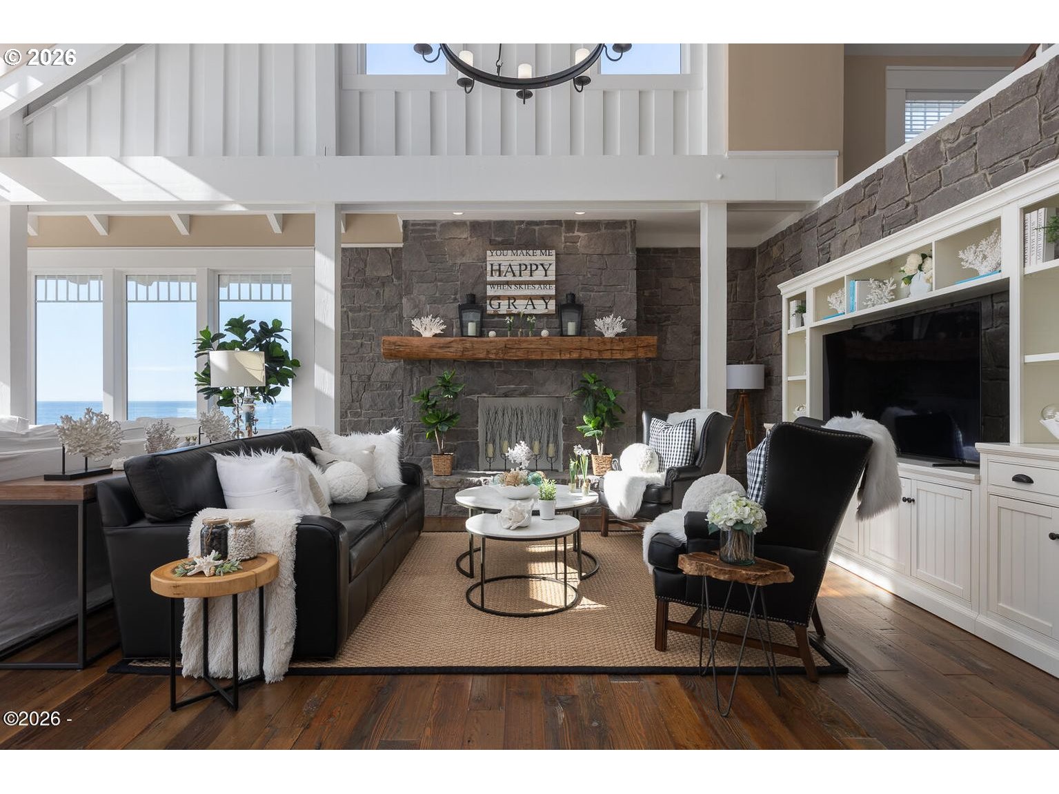 520 Cove Point Depoe Bay, OR 97341 - Photo 7 of 43 a living room with furniture a flat screen tv and a fireplace