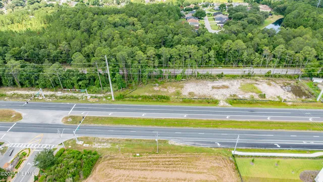 a view of a swimming pool with a yard