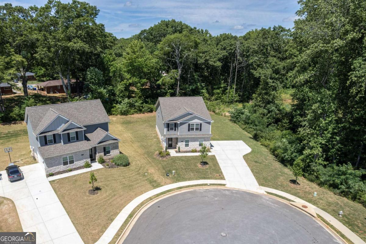 653 Meadows Farm Way Monroe, GA 30655 - Photo 4 of 34 an aerial view of a house with swimming pool