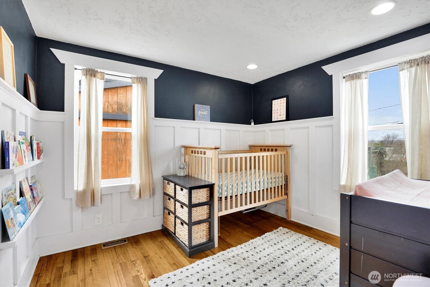 2819 West Olympic Avenue Spokane, WA 99205 - Photo 15 of 40 a view of a bedroom with wooden floor and windows
