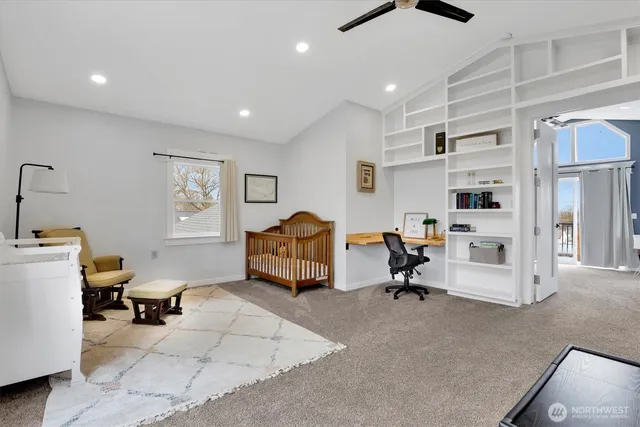 a room with furniture a air conditioner and a window