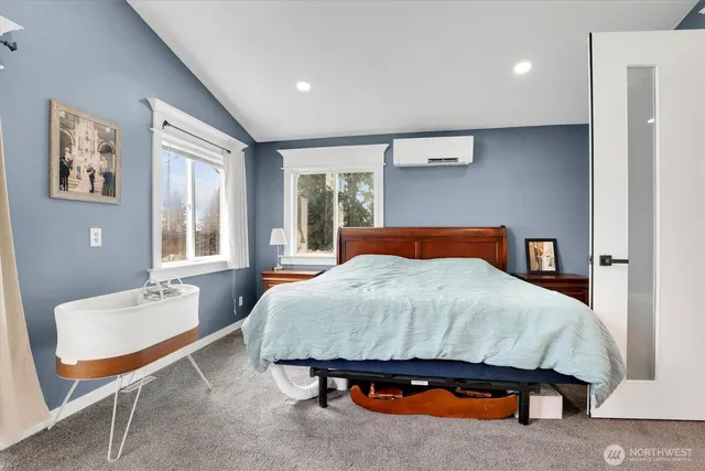 a bedroom with a bed and window