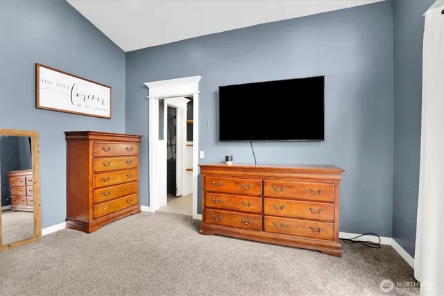 a room with furniture and a flat screen tv
