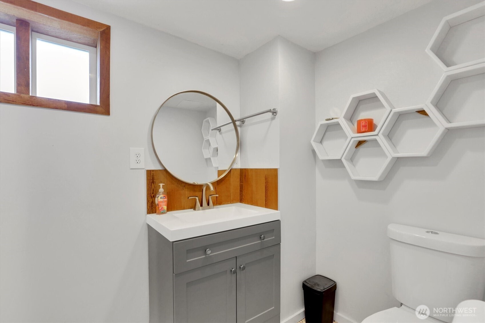 2819 West Olympic Avenue Spokane, WA 99205 - Photo 26 of 40 a bathroom with a sink mirror and toilet