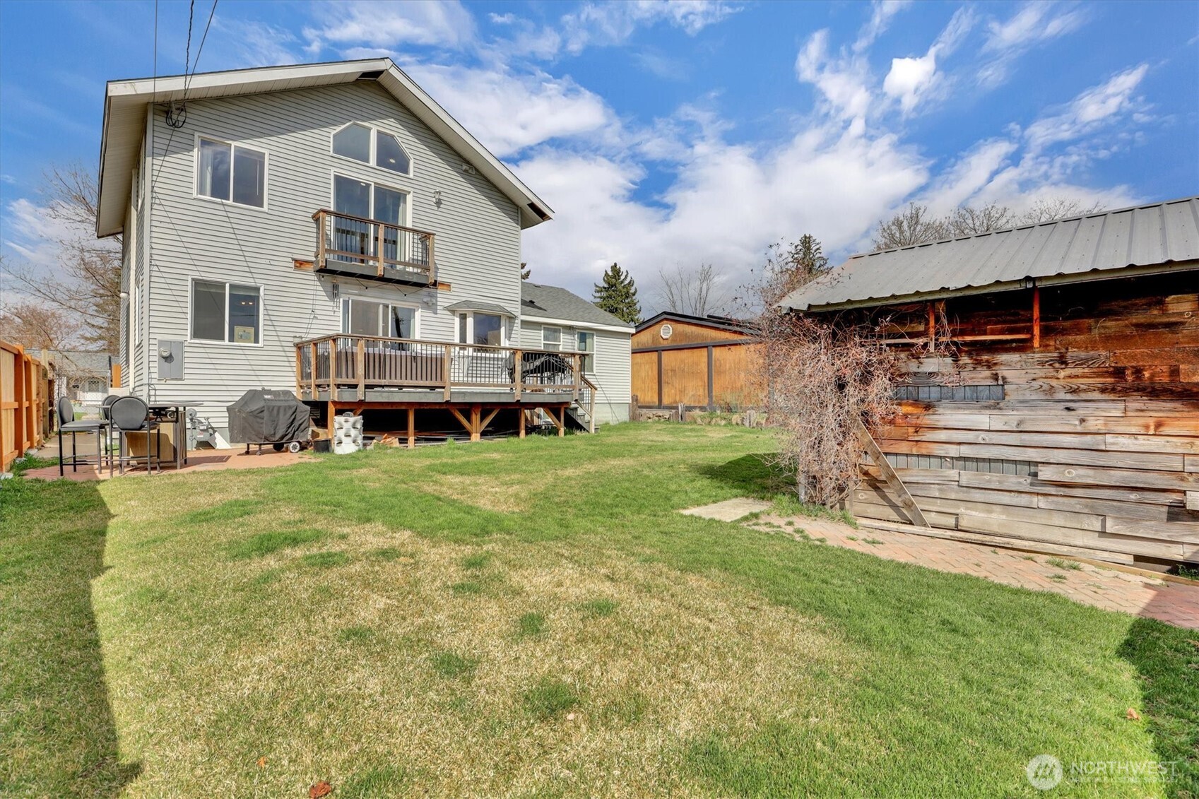2819 West Olympic Avenue Spokane, WA 99205 - Photo 32 of 40 a view of a house with a yard and sitting area