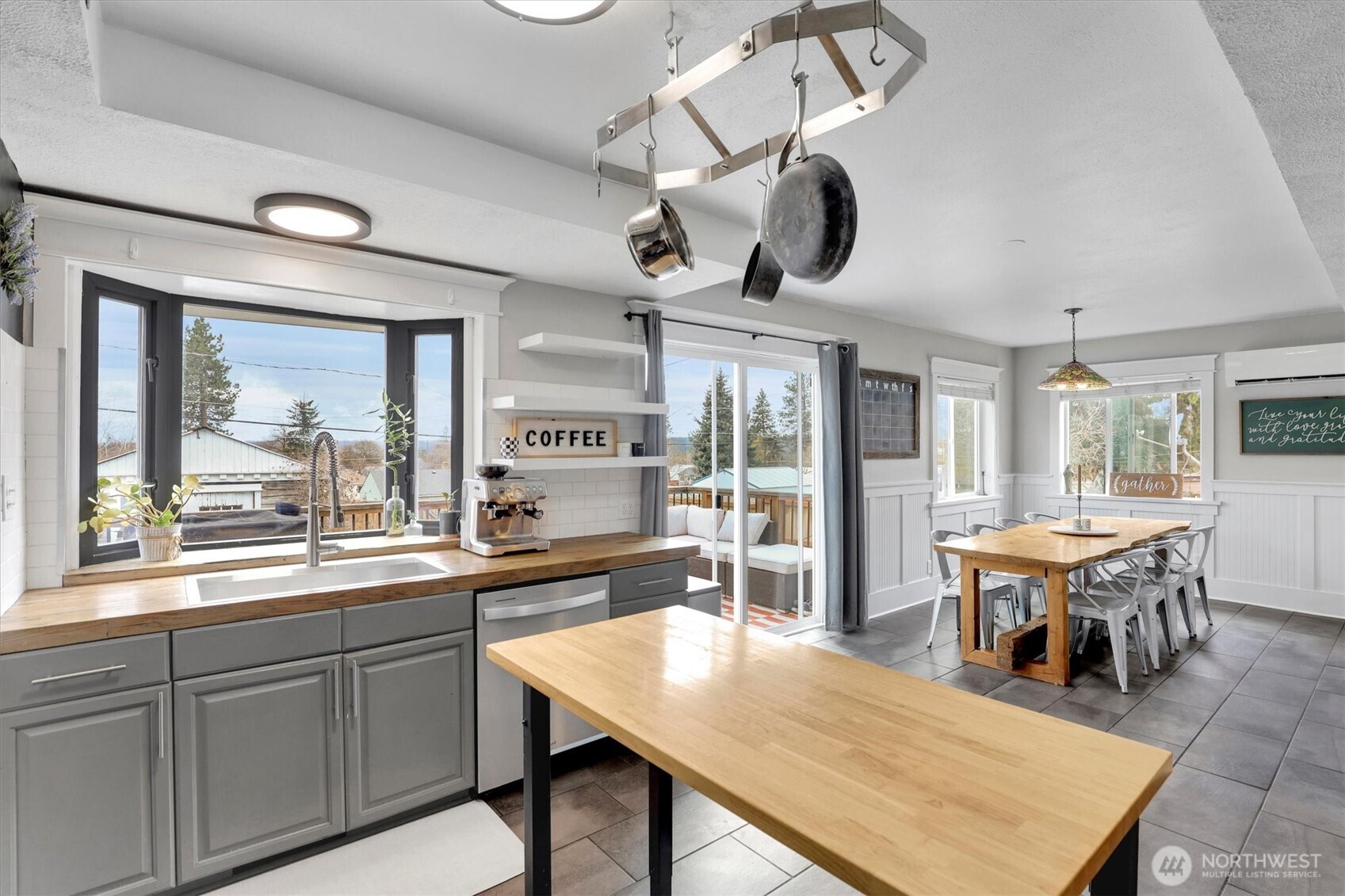 2819 West Olympic Avenue Spokane, WA 99205 - Photo 7 of 40 a kitchen with a table chairs and wooden floor