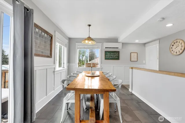 a dining room with furniture and window