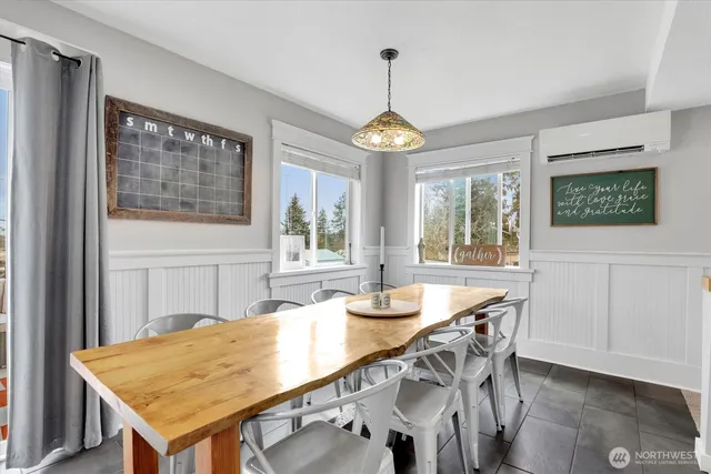 a view of a dining room with furniture wooden floor and chandelier