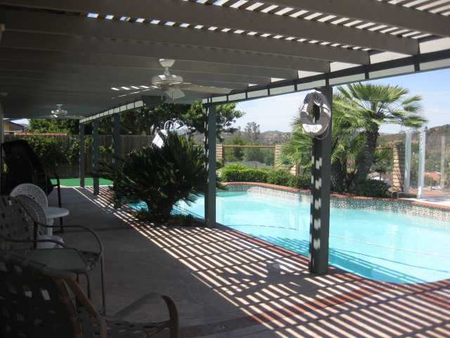 13318 Tobiasson Road Poway, CA 92064 - Photo 14 of 21 The patio cover is perfect for letting in just the right amount of sun and shade. Time for a dip!