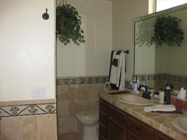 13318 Tobiasson Road Poway, CA 92064 - Photo 10 of 21 Nothing has been spared here. The travertine walls and custom glass shower door are just the beginning...