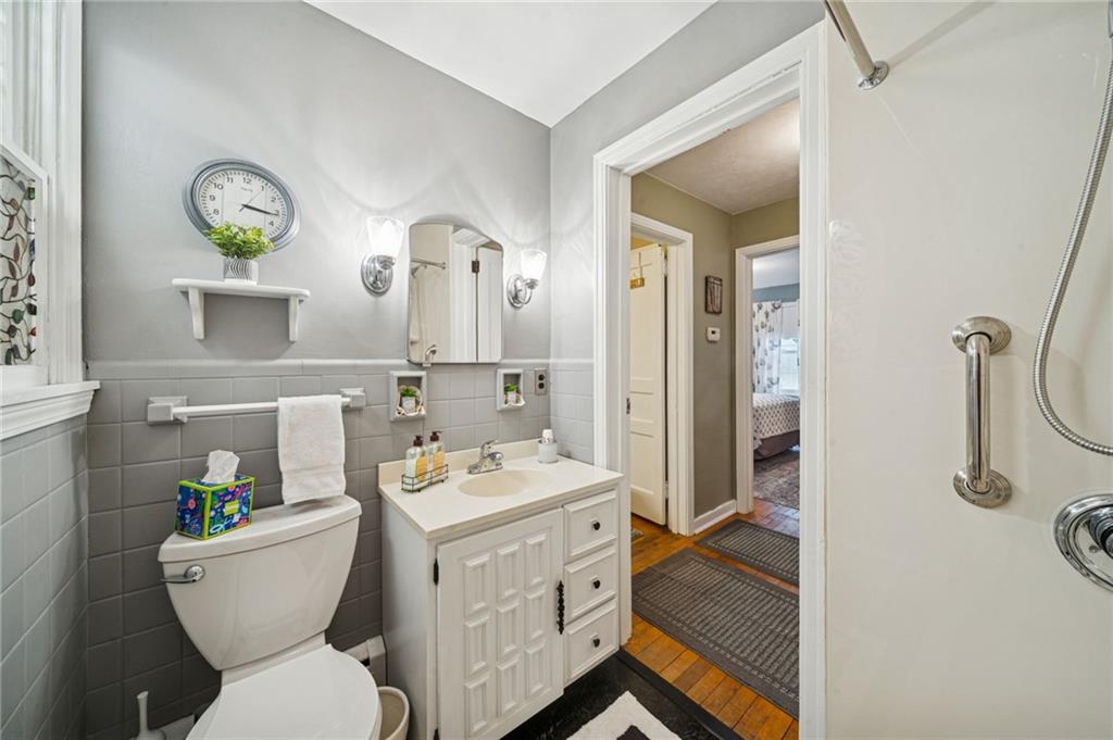 31 Locust Lane Pittsburgh, PA 15241 - Photo 12 of 35 a bathroom with a sink mirror vanity and toilet