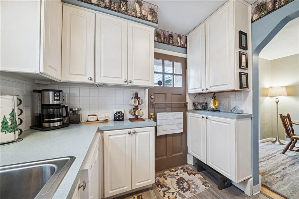 31 Locust Lane Pittsburgh, PA 15241 - Photo 10 of 35 a kitchen with white cabinets and window