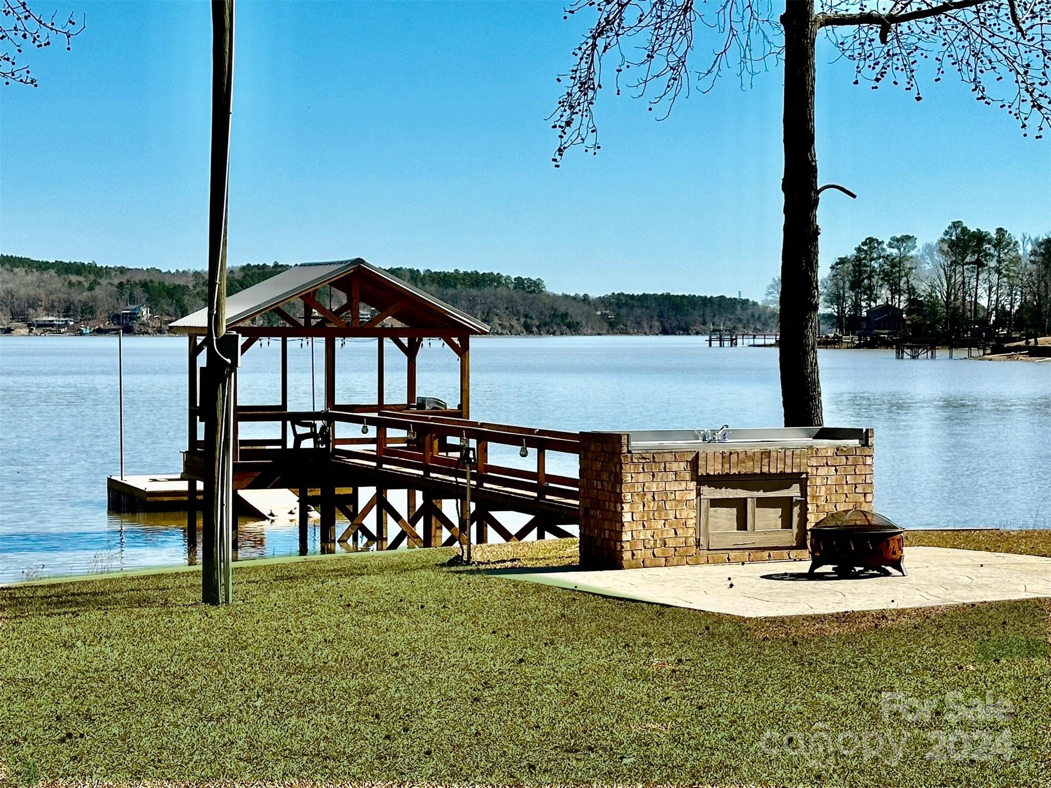 1592 Lake Road Ridgeway, SC 29130 - Photo 3 of 48 a view of a lake with a table and chairs