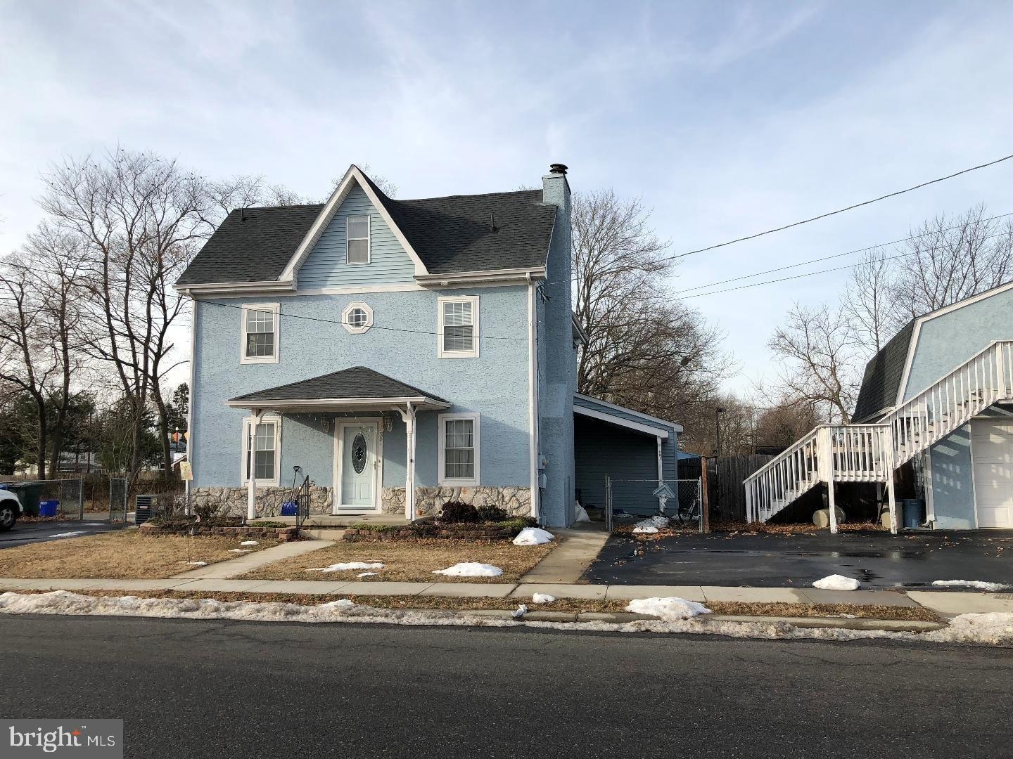 581 Fish Pond Road, Unit UP Glassboro, NJ 08028 - Photo 1 of 10 a front view of a house with a yard