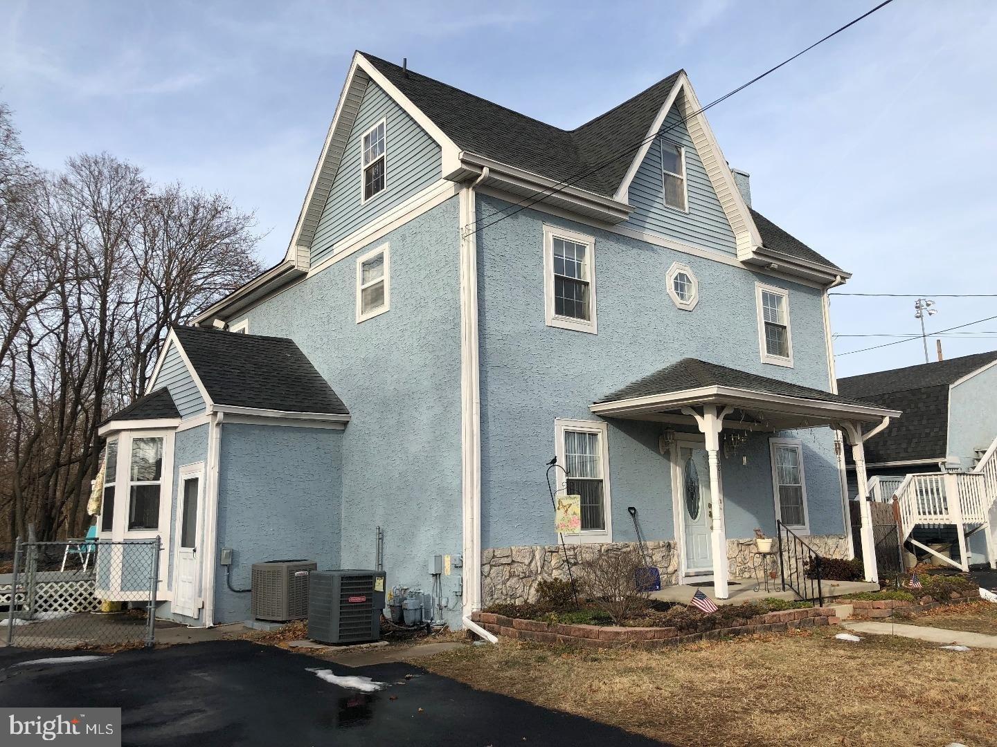 581 Fish Pond Road, Unit UP Glassboro, NJ 08028 - Photo 2 of 10 a front view of a house with yard