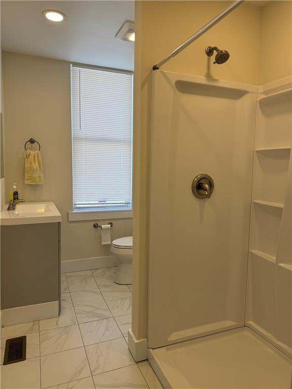 94 South 18th Street, Unit 2 Pittsburgh, PA 15203 - Photo 12 of 20 a bathroom with a sink a toilet and shower