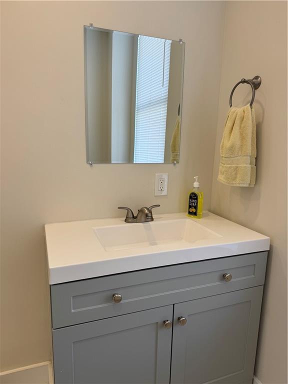 94 South 18th Street, Unit 2 Pittsburgh, PA 15203 - Photo 13 of 20 a bathroom with a sink and a mirror