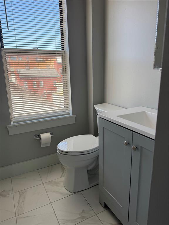 94 South 18th Street, Unit 2 Pittsburgh, PA 15203 - Photo 15 of 20 a bathroom with a toilet a sink and a window