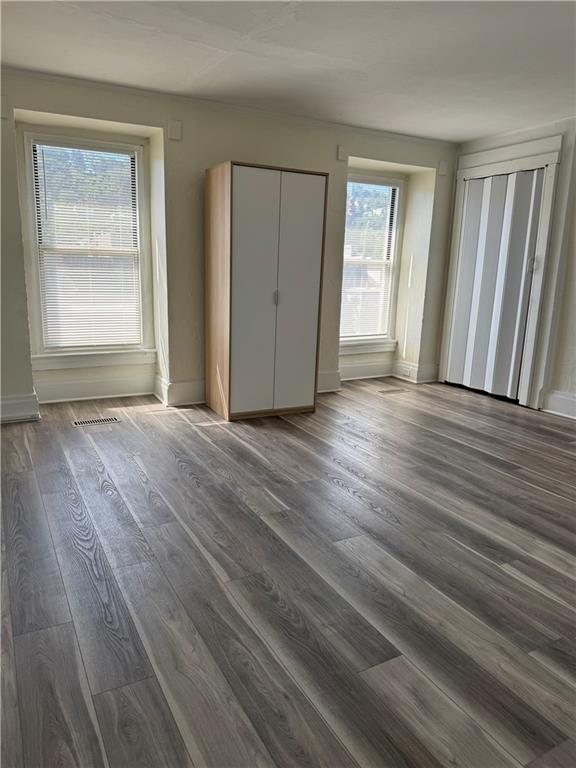 94 South 18th Street, Unit 2 Pittsburgh, PA 15203 - Photo 17 of 20 a view of an empty room with wooden floor and window