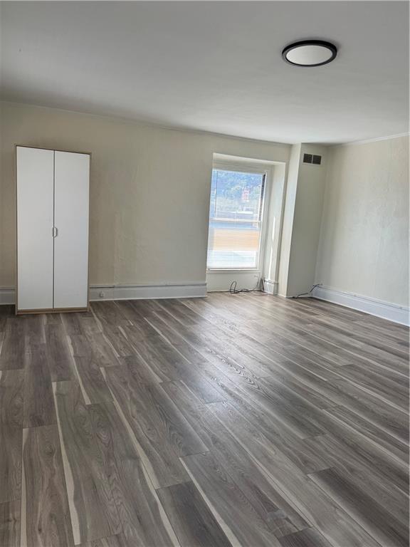 94 South 18th Street, Unit 2 Pittsburgh, PA 15203 - Photo 19 of 20 an empty room with wooden floor and windows