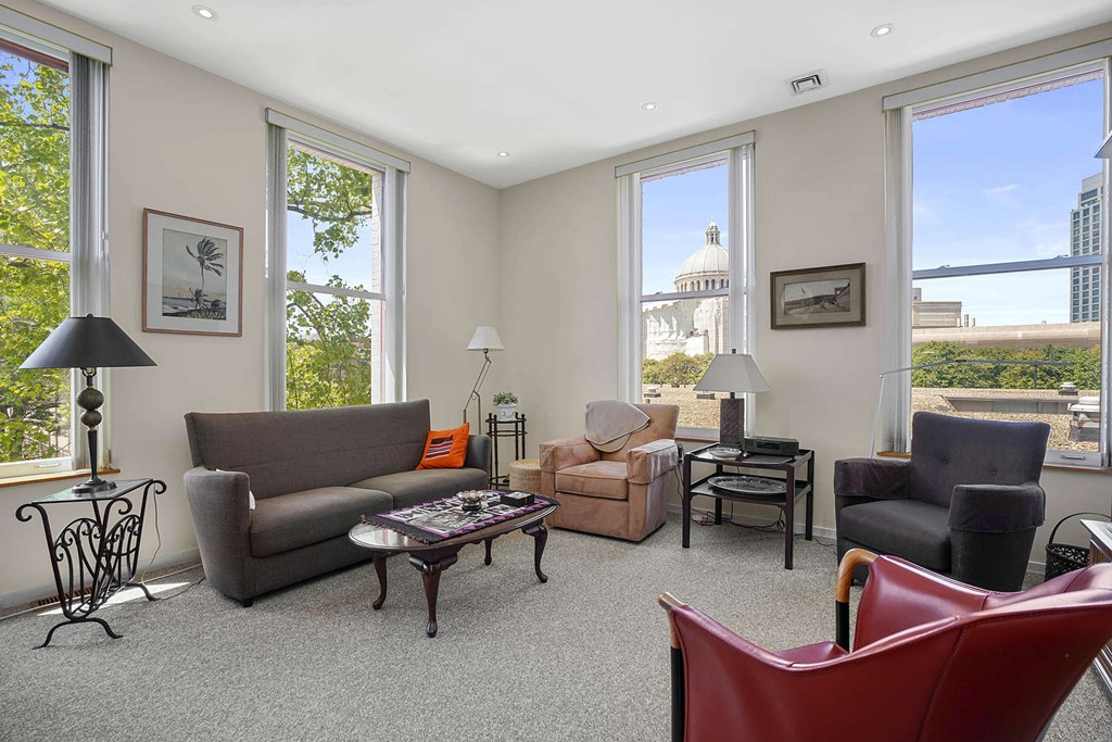 a living room with furniture and a window