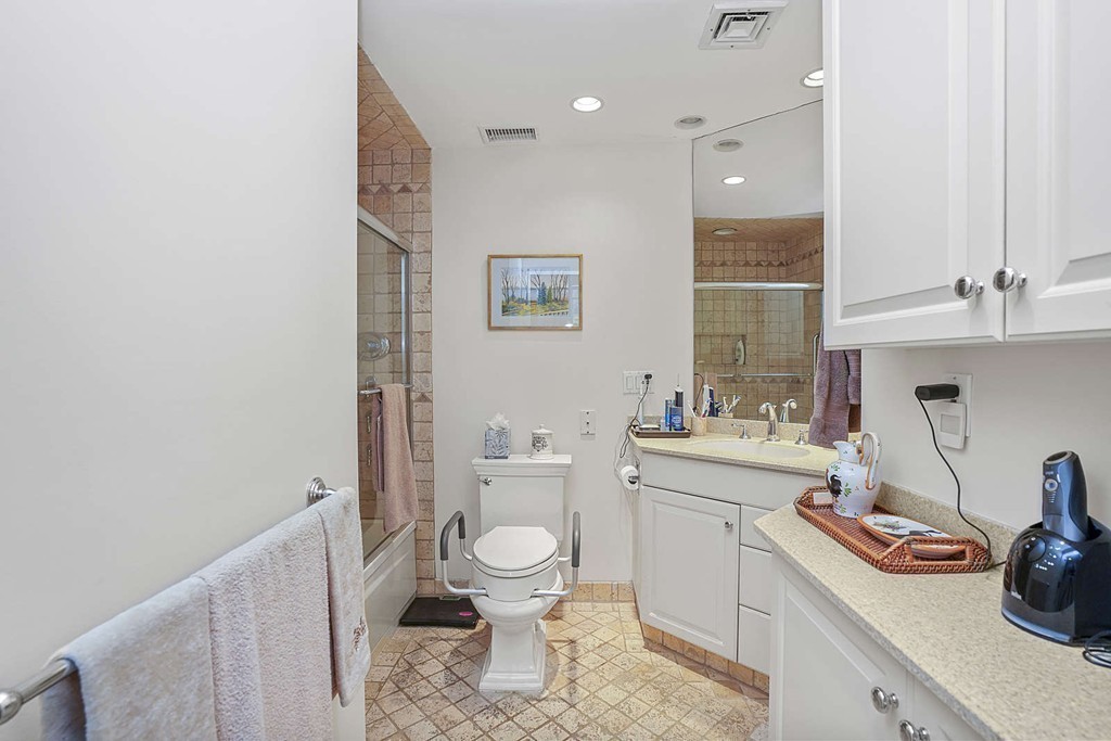 145 St Botolph Street, Unit 21 Boston, MA 02115 - Photo 13 of 23 a bathroom with a toilet a sink and a mirror