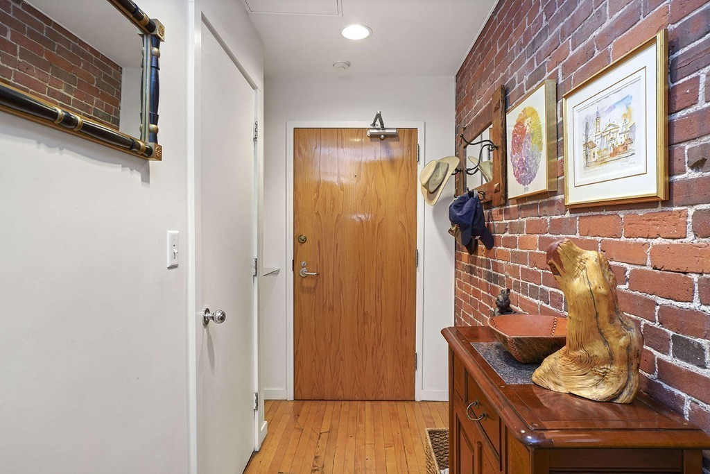 145 St Botolph Street, Unit 21 Boston, MA 02115 - Photo 15 of 23 a living room with furniture and a window