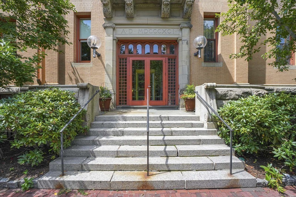 145 St Botolph Street, Unit 21 Boston, MA 02115 - Photo 20 of 23 a front view of a house with potted plants