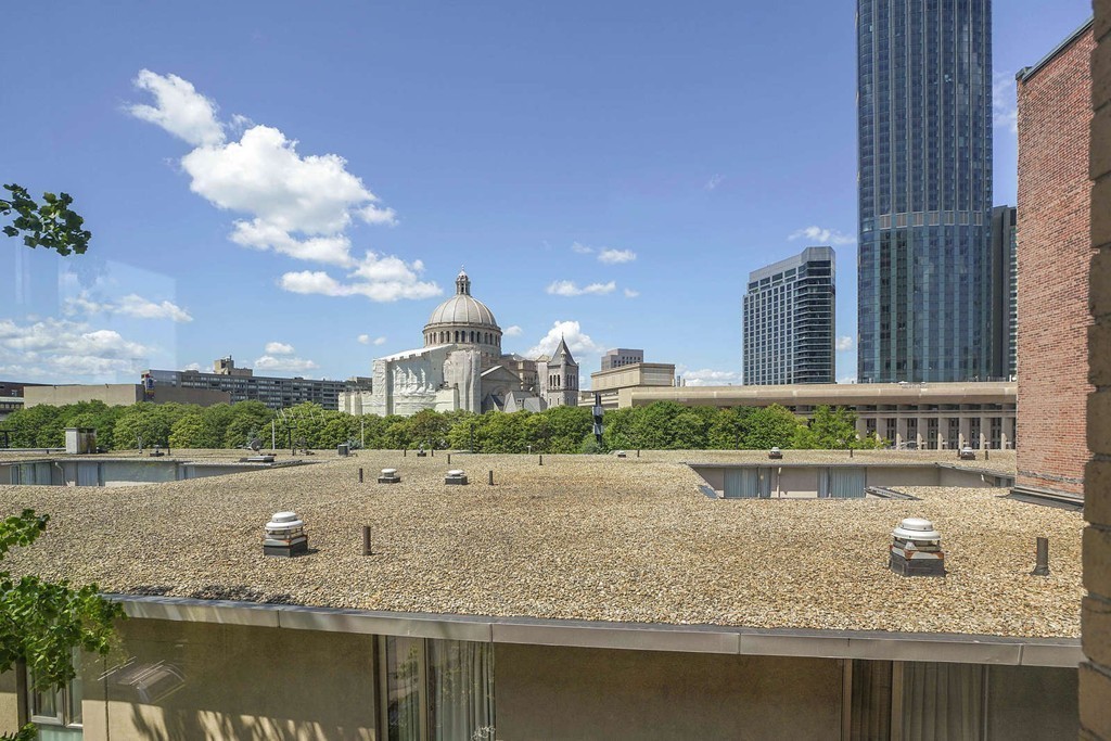 145 St Botolph Street, Unit 21 Boston, MA 02115 - Photo 22 of 23 a view of a lake with a building and a lake view
