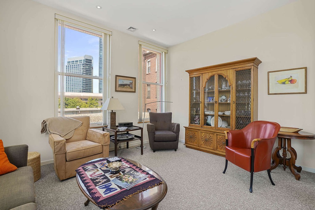 145 St Botolph Street, Unit 21 Boston, MA 02115 - Photo 3 of 23 a living room with furniture and a window