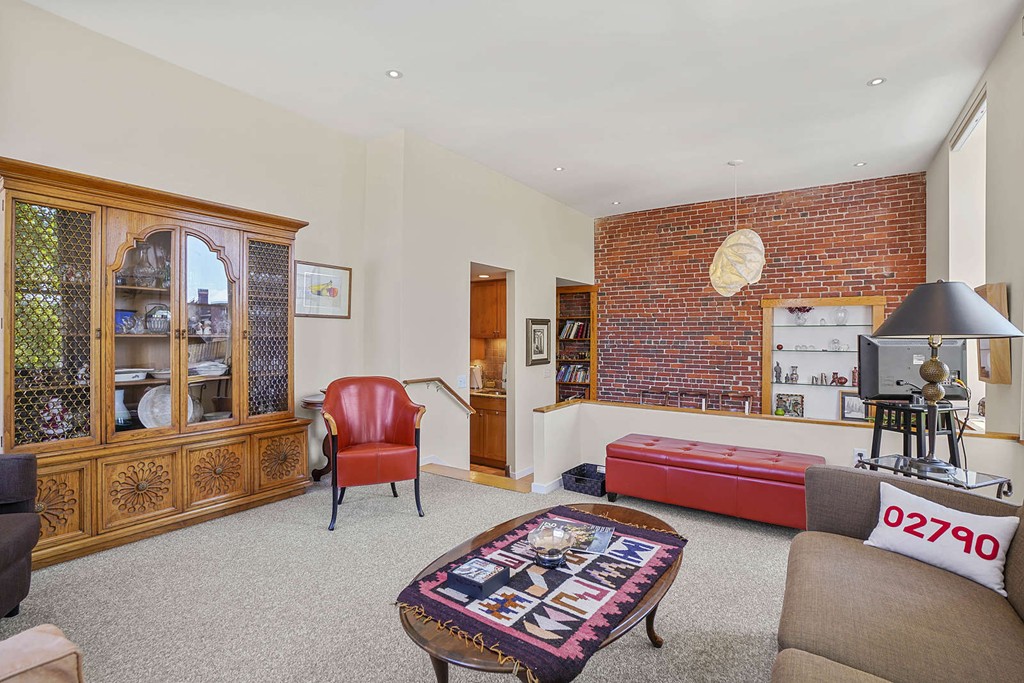 145 St Botolph Street, Unit 21 Boston, MA 02115 - Photo 4 of 23 a bedroom with furniture and a lamp