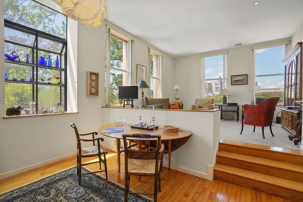 145 St Botolph Street, Unit 21 Boston, MA 02115 - Photo 5 of 23 a living room with furniture and a floor to ceiling window