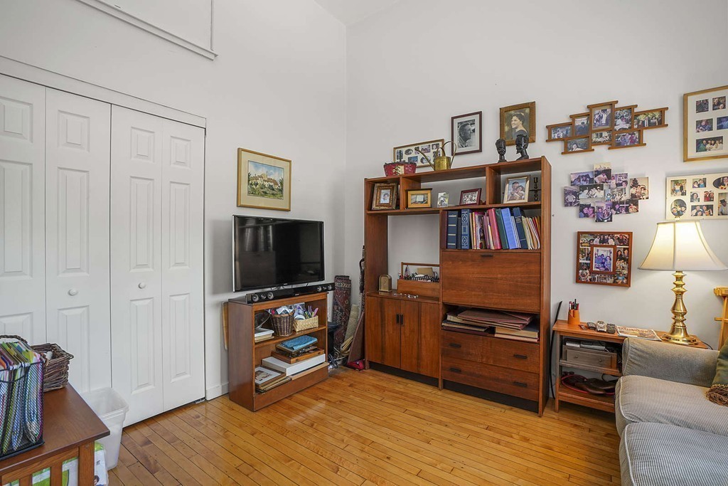 145 St Botolph Street, Unit 21 Boston, MA 02115 - Photo 10 of 23 a view of a livingroom with furniture and wooden floor