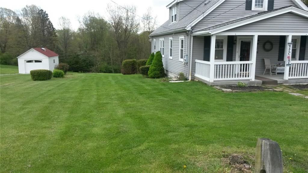 9 Vigne Road Coraopolis, PA 15108 - Photo 16 of 19 SIDE LOT UP TO SHRUBS/ GARAGE NOT THEIRS