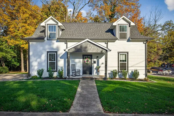 a front view of a house with a yard