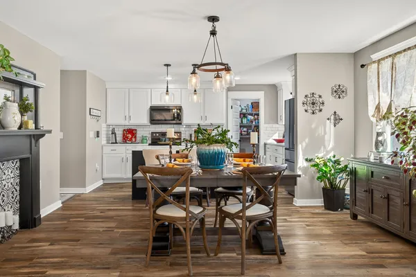 a view of a dining room with furniture window and wooden floor