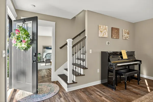 a view of a workspace with furniture and entryway