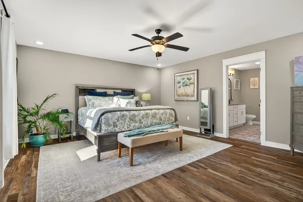 a bedroom with a bed and a table