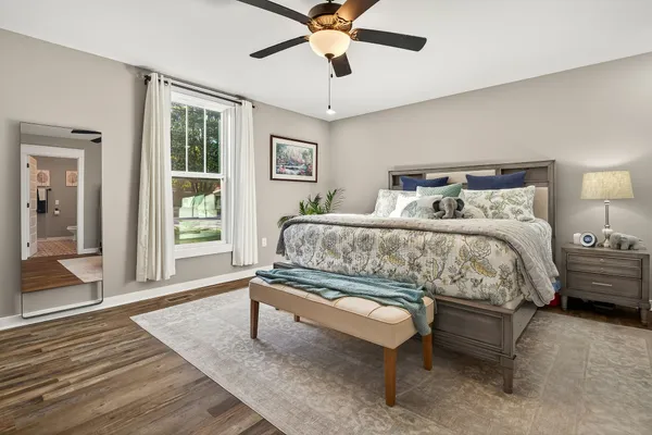 a bedroom with a bed and window