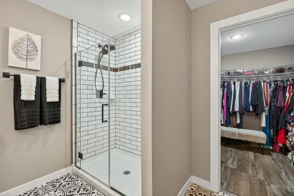 a view of a walk in closet and bathroom
