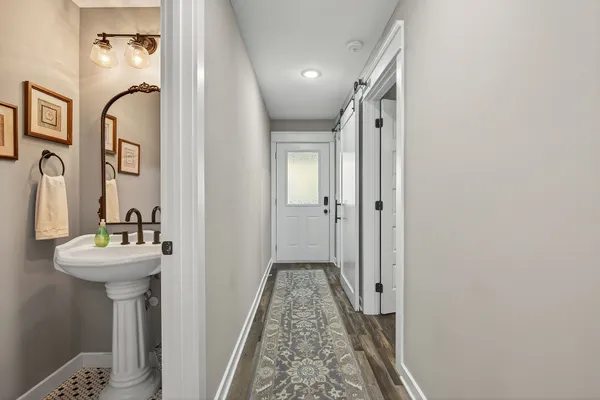 a bathroom with a sink a mirror and shower