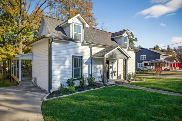 a front view of a house with a yard