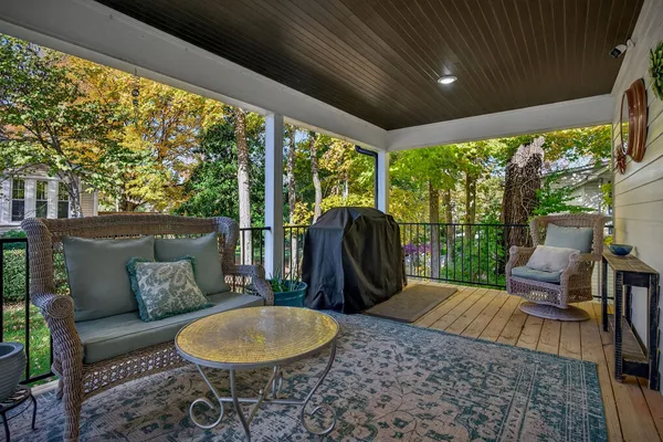 a backyard of a house with table and chairs