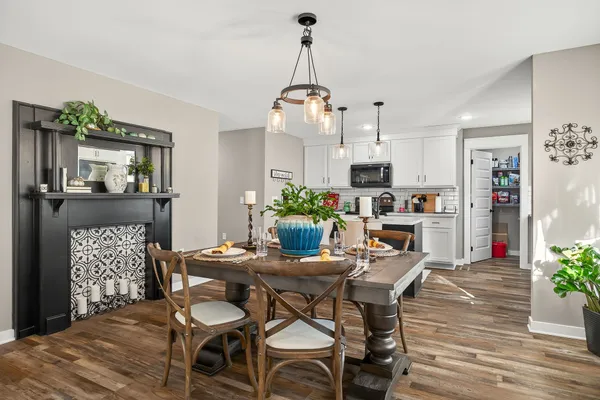 a view of a dining room with furniture and wooden floor