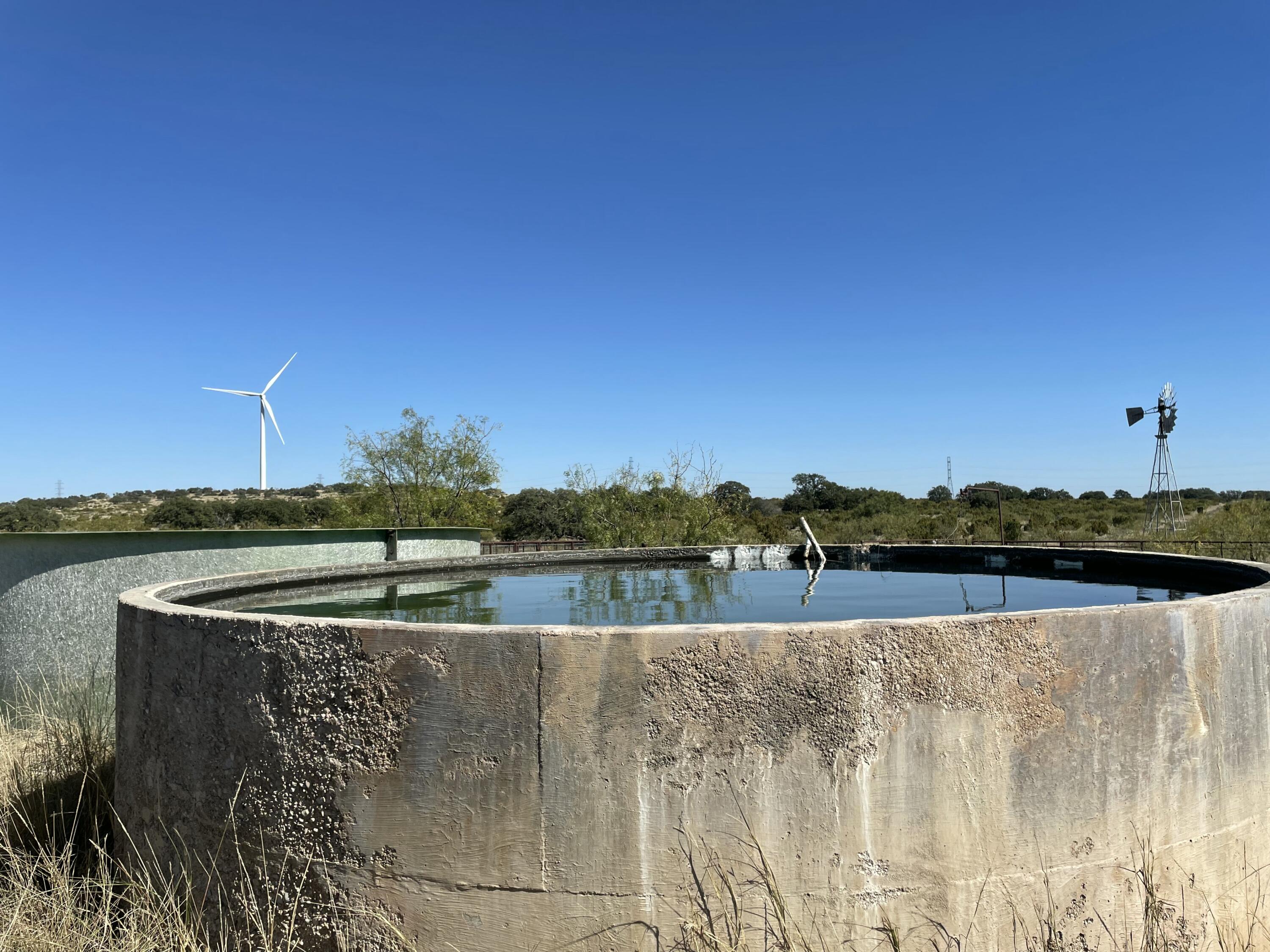 0 Allen Road Christoval, TX 76935 - Photo 29 of 32 a view of a lake with houses in the back