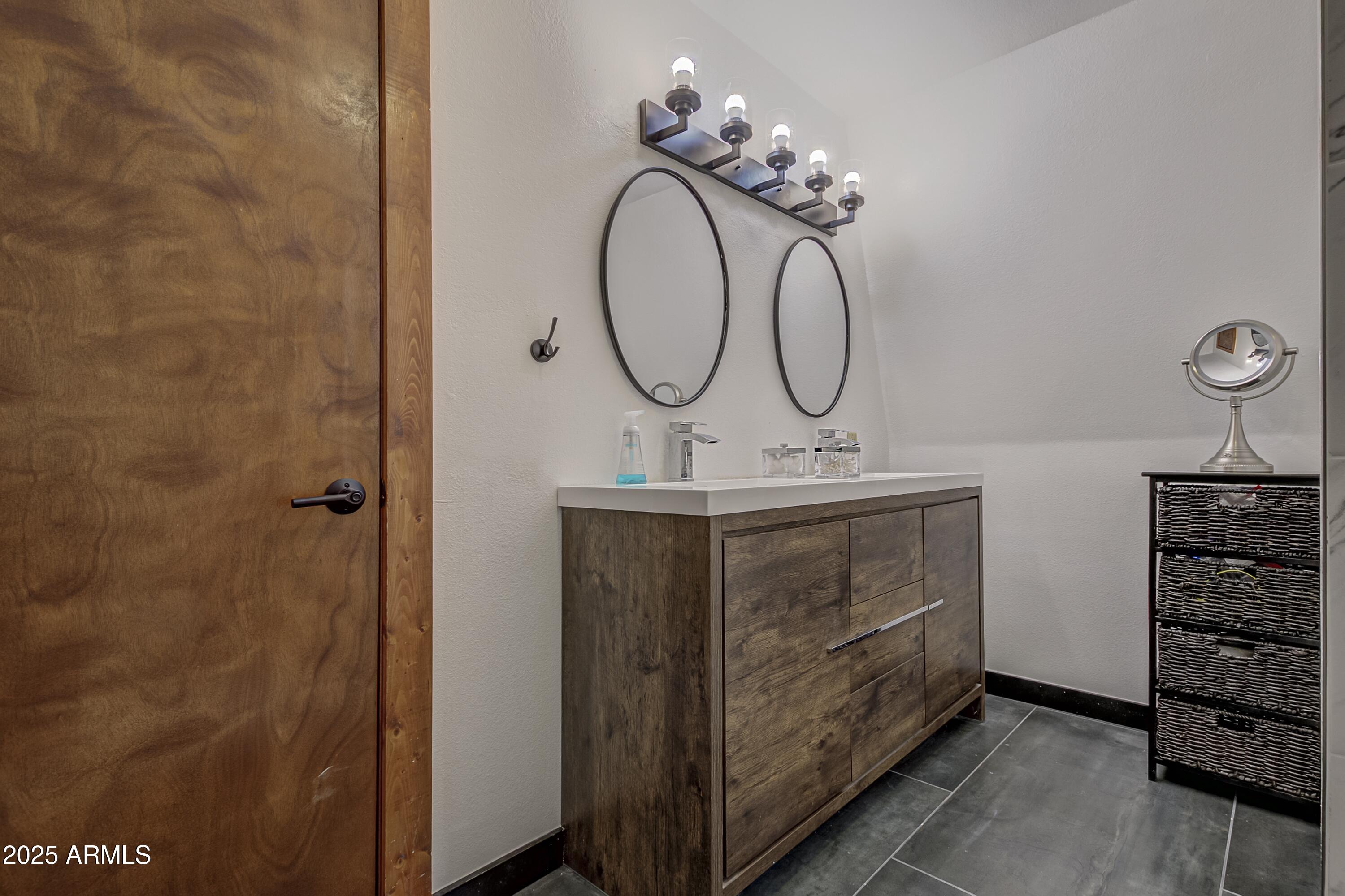 4763 Ernies Road Strawberry, AZ 85544 - Photo 12 of 50 a bathroom with a sink and a mirror