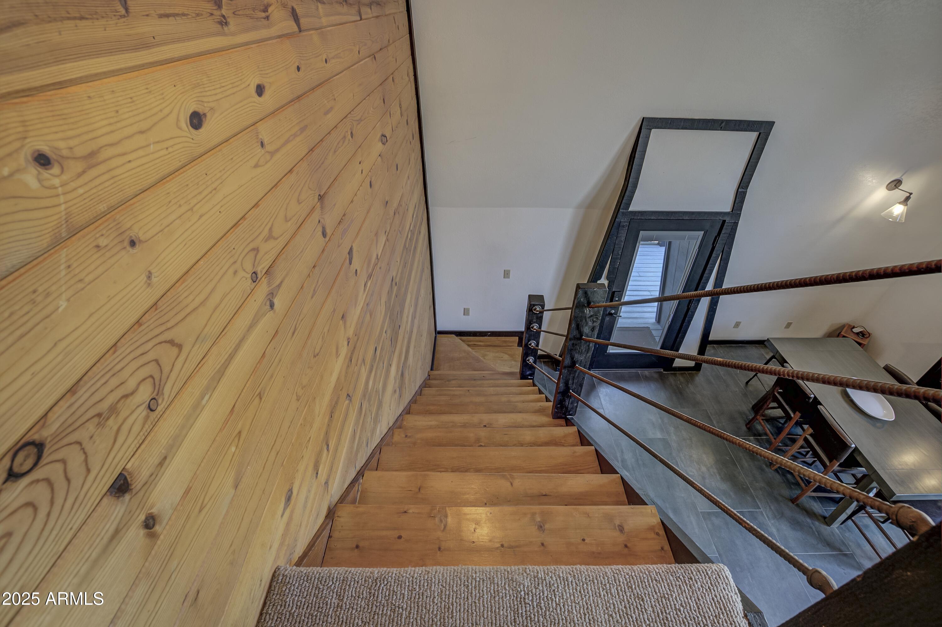 4763 Ernies Road Strawberry, AZ 85544 - Photo 15 of 50 a view of a hallway with wooden floor and staircase