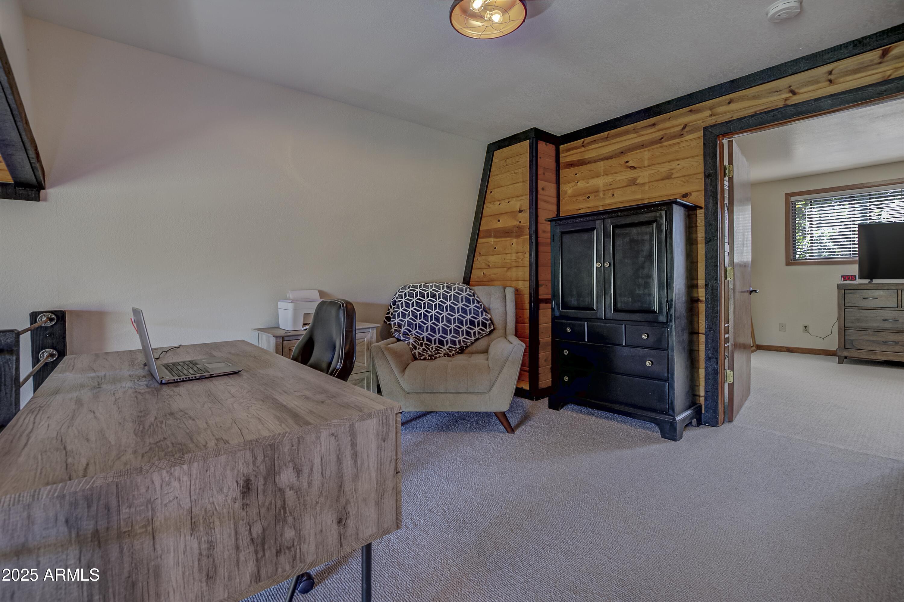 4763 Ernies Road Strawberry, AZ 85544 - Photo 18 of 50 a bedroom with bed and window