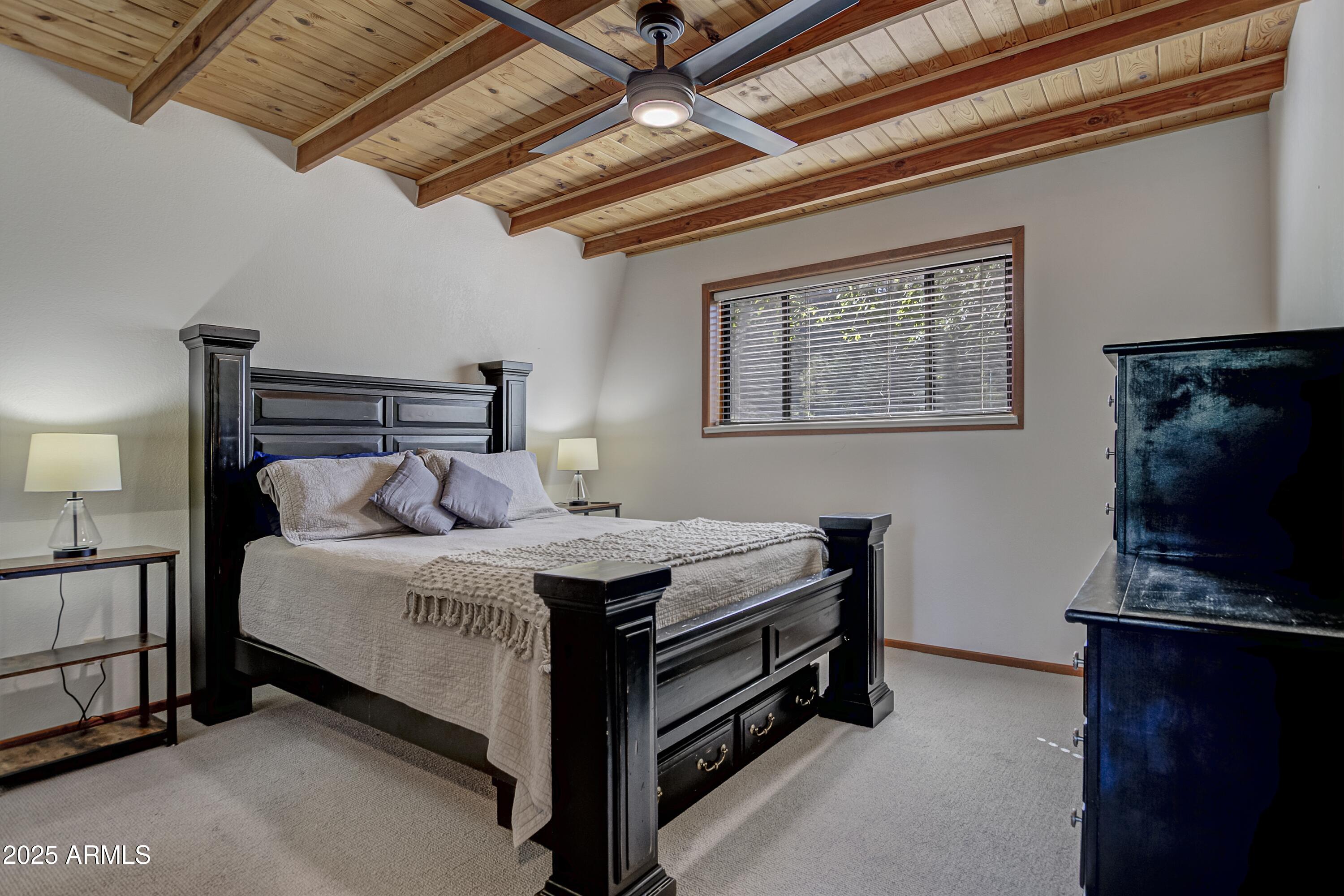 4763 Ernies Road Strawberry, AZ 85544 - Photo 19 of 50 a bed room with a bed and a television